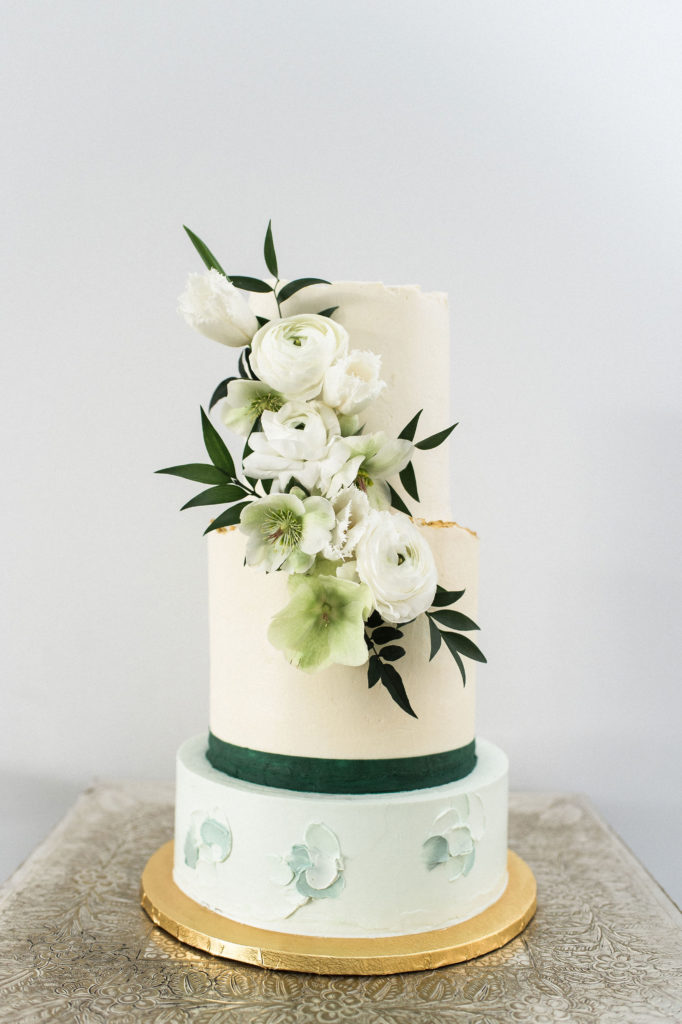 Artist for Humanity Epicenter green and white wedding cake with gold plate