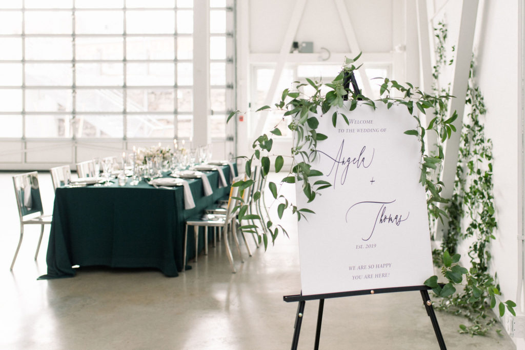 Artist for Humanity Epicenter bride and groom signage with tables setup