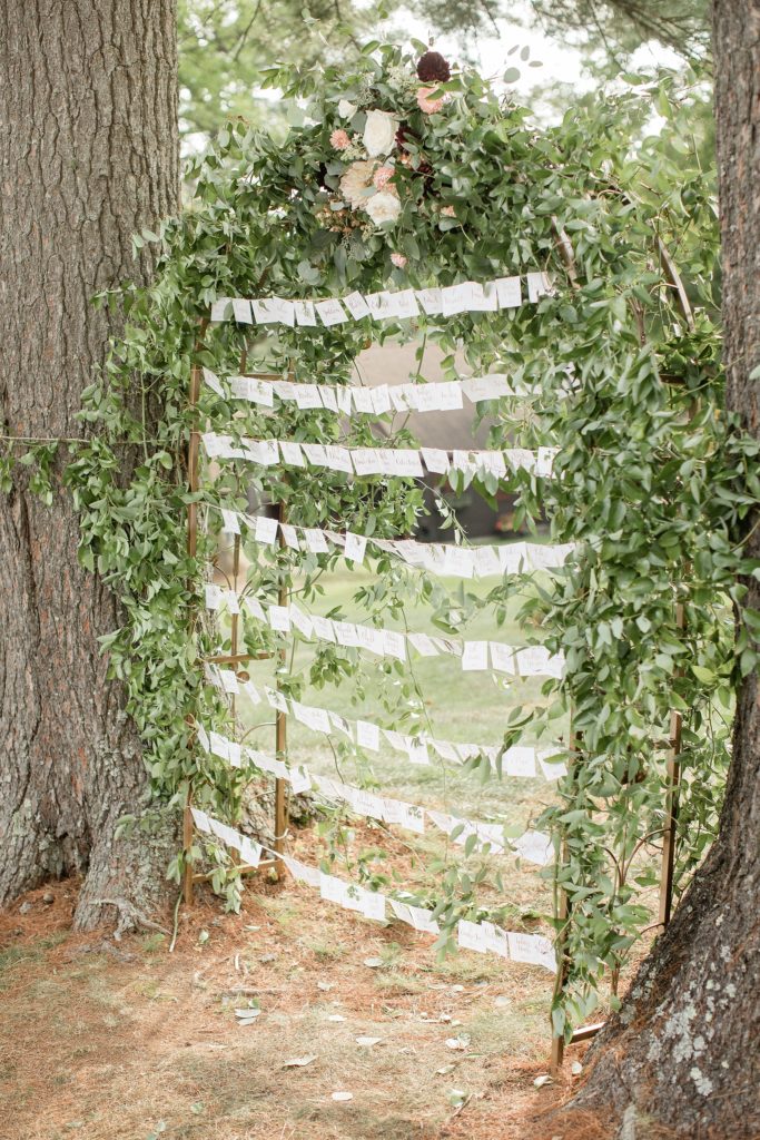 Prita and Mac Twin Lake Village wedding escort cards tied next to trees